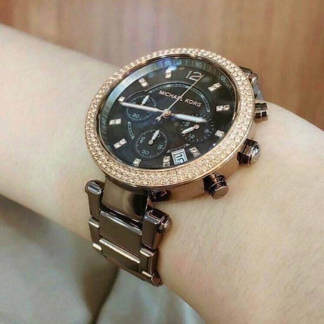 Michael Kors Parker chronograph watch worn on wrist showing chocolate case and bracelet