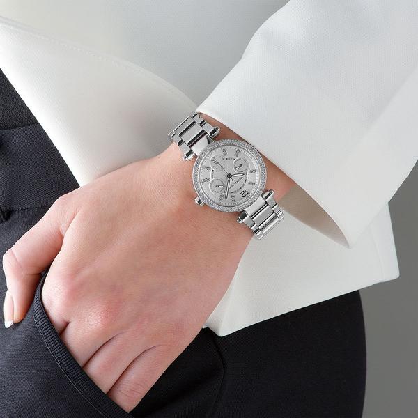 Michael Kors Parker MK5615 silver watch worn on wrist with white shirt cuff