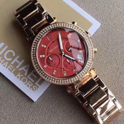 Michael Kors Parker chronograph watch on packaging showing dial and rose gold bracelet