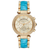 Michael Kors Parker gold-tone chronograph watch with diamond bezel, cream dial, and blue crocodile-embossed strap