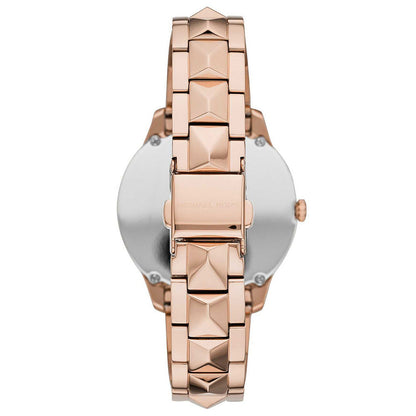 Back view of Michael Kors Runway Mercer watch with caseback and rose gold pyramid stud bracelet