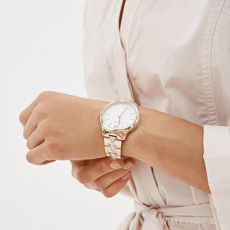 Michael Kors Runway Mercer watch worn on wrist showing white dial and rose gold case