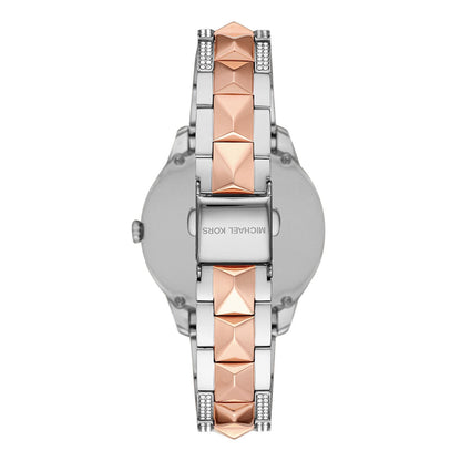 Case back view of Michael Kors Runway Mercer watch showing two-tone rose gold and silver design
