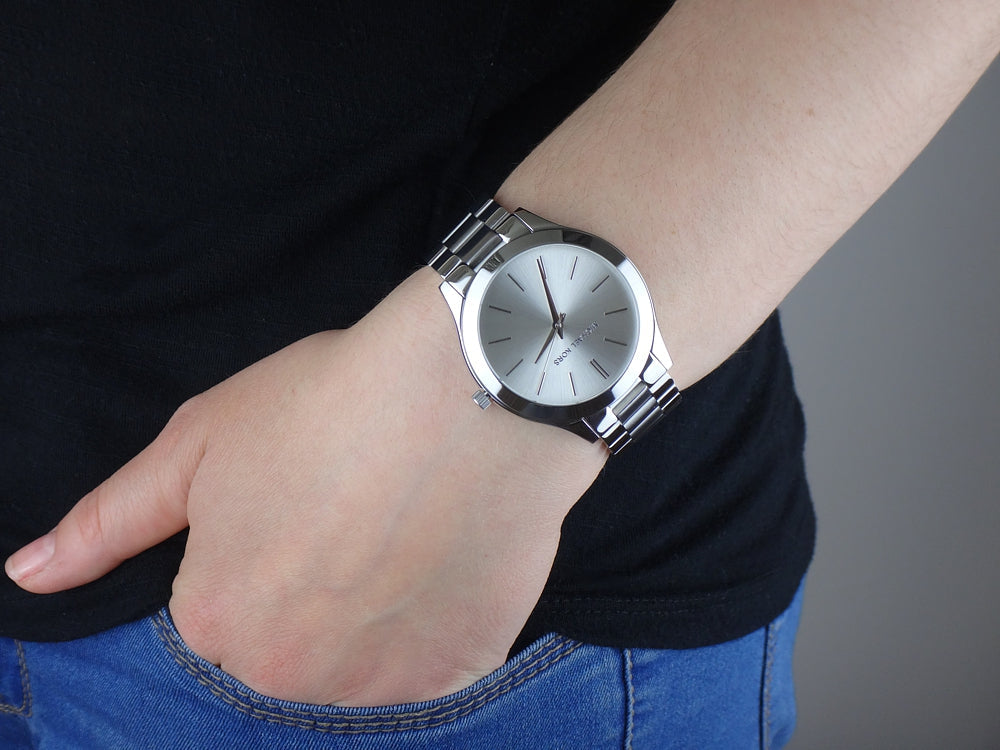 Michael Kors Runway silver watch worn on wrist with minimalist dial design