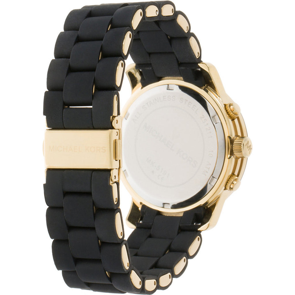 Caseback of Michael Kors Runway MK5191 watch showing black rubber strap with gold hardware