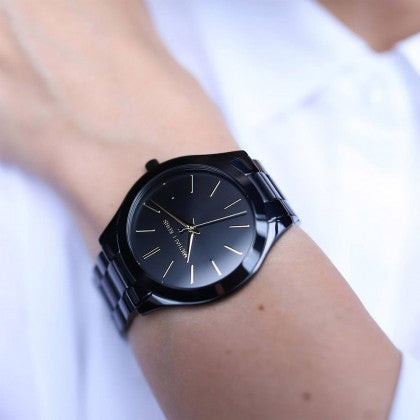 Michael Kors Slim Runway black watch on wrist displaying minimalist dial detail