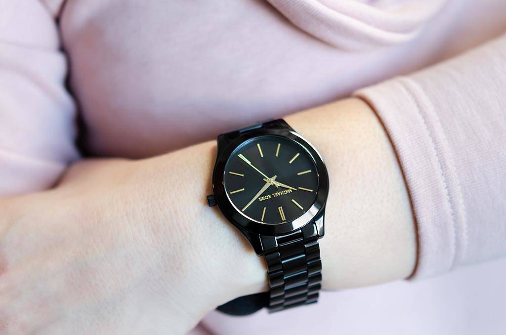 Michael Kors Slim Runway black watch worn on wrist showing face and bracelet fit