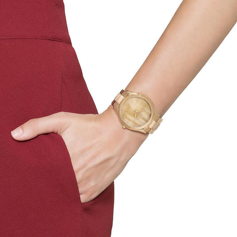 Michael Kors Slim Runway women's watch on wrist with burgundy clothing