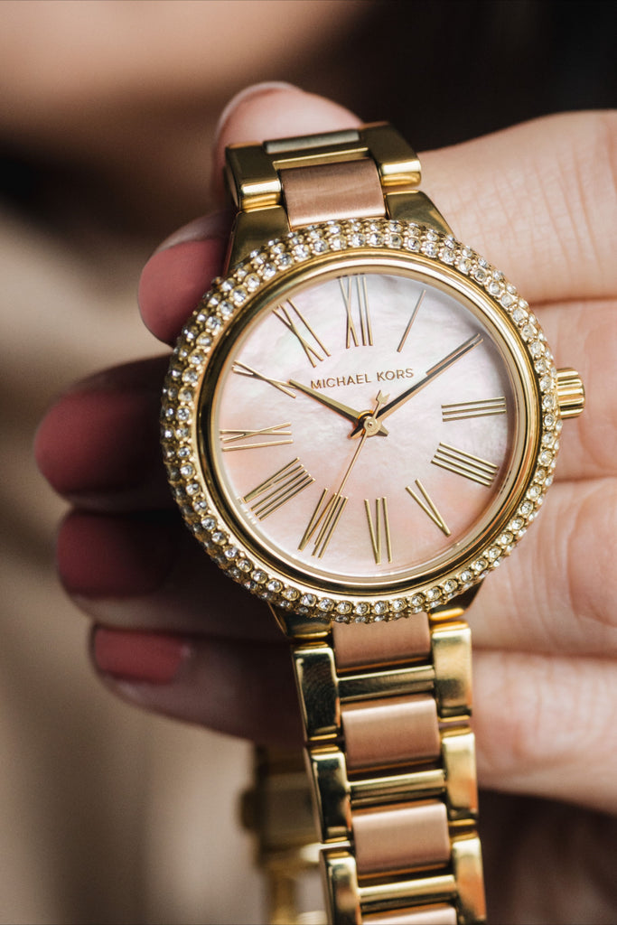 Michael Kors Taryn MK6564 on-wrist view showing pink dial and crystal-set bezel