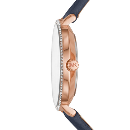 Side profile of MK2804 showing rose gold case depth and crystal-set bezel detail