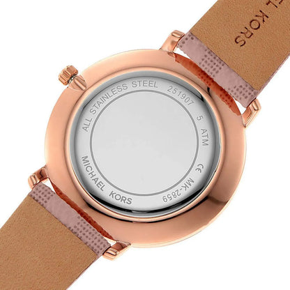 Dial detail of Michael Kors Pyper showing silver dial, rose gold hands, and hour markers