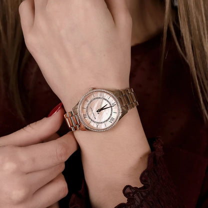 Michael Kors Lauryn rose gold women's watch worn on wrist with crystal bezel detail