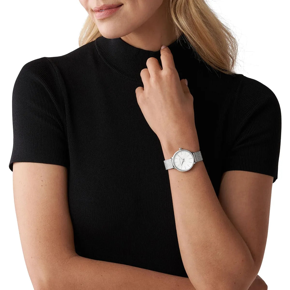 Michael Kors Mini Pyper watch worn on wrist with white dial and silver mesh band