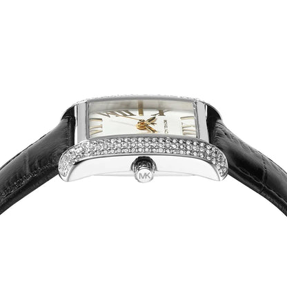 Top-down view of the white dial with Roman numerals, pavé crystal bezel, and MK logo