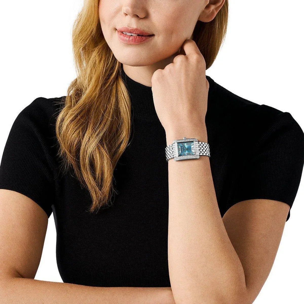 Michael Kors Emery silver-tone watch worn on wrist with turquoise dial visible