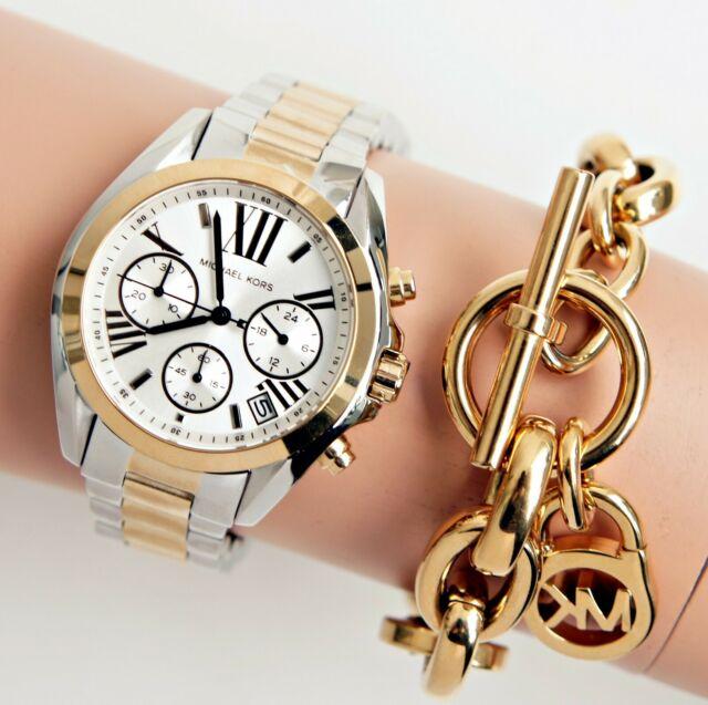 Michael Kors Bradshaw chronograph watch worn on wrist showing dial and two-tone bracelet