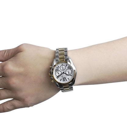 Michael Kors Bradshaw chronograph watch on wrist displaying Roman numerals and chronograph subdials