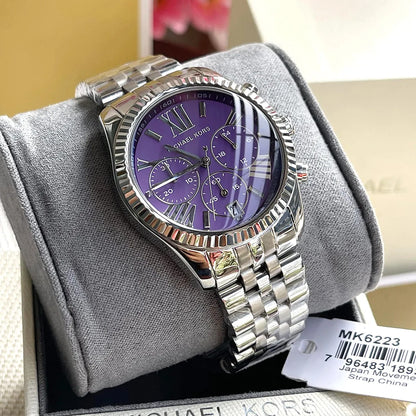 Michael Kors Lexington MK6223 chronograph watch displayed on gray wrist rest pillow