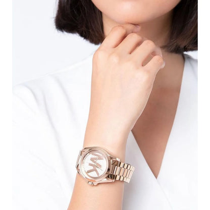 Michael Kors Bradshaw watch worn on wrist with rose gold case and metal bracelet