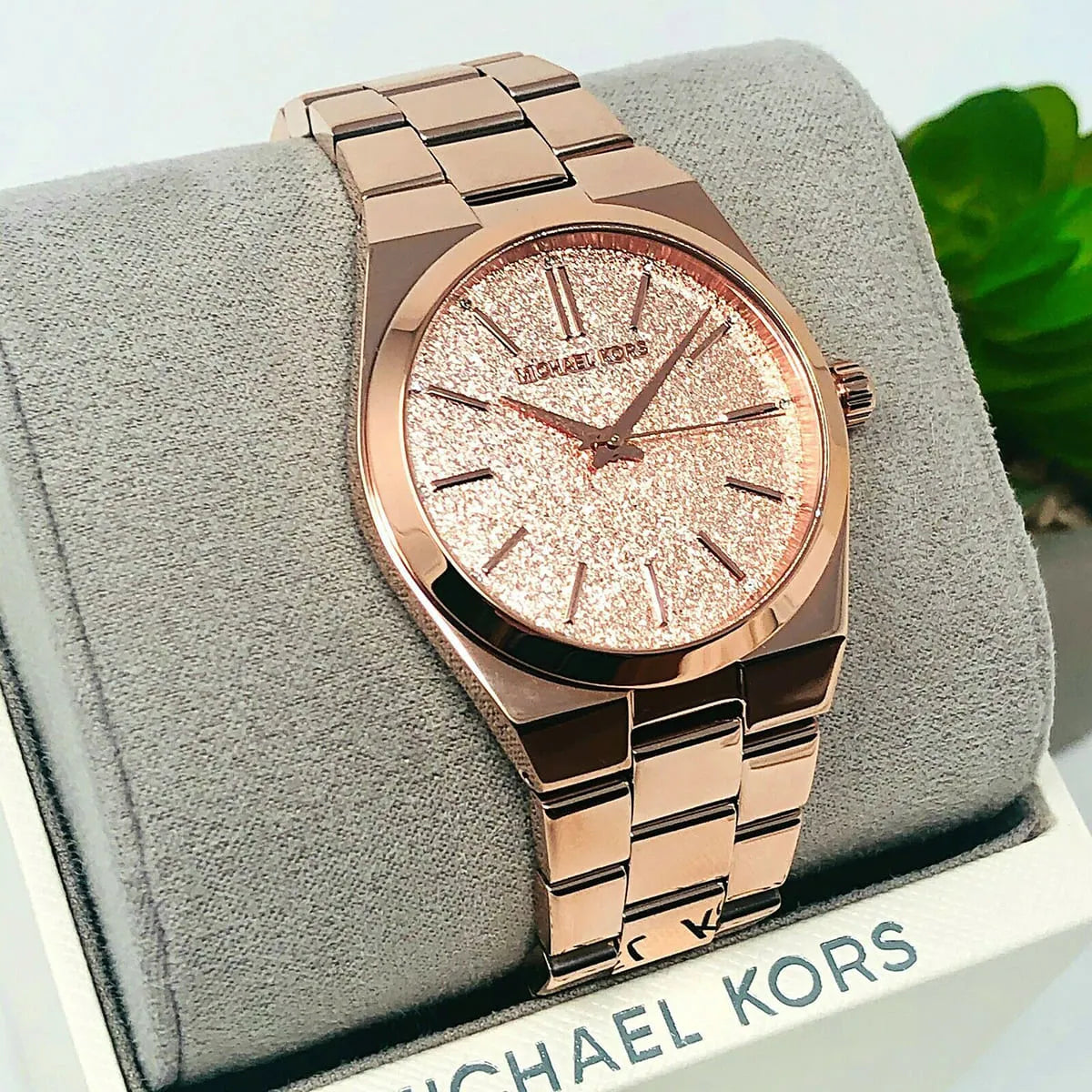 Michael Kors Channing MK6624 rose gold watch displayed on fabric cushion
