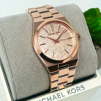 Michael Kors Channing MK6624 rose gold watch displayed on fabric cushion