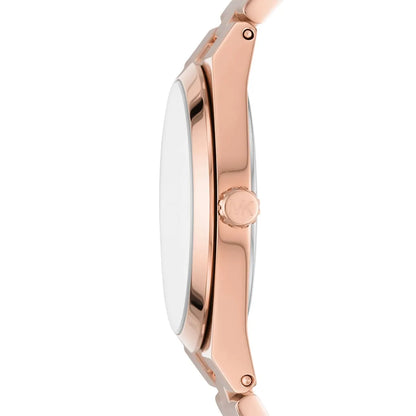 Side profile of Michael Kors Channing rose gold watch showing case thickness and crown