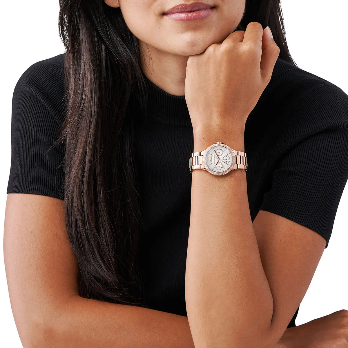 Michael Kors Camille chronograph watch worn on wrist showing white dial and rose gold case