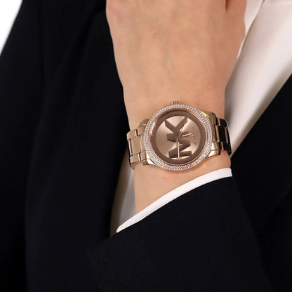 Michael Kors Tibby rose-gold women's watch worn on wrist with crystal bezel