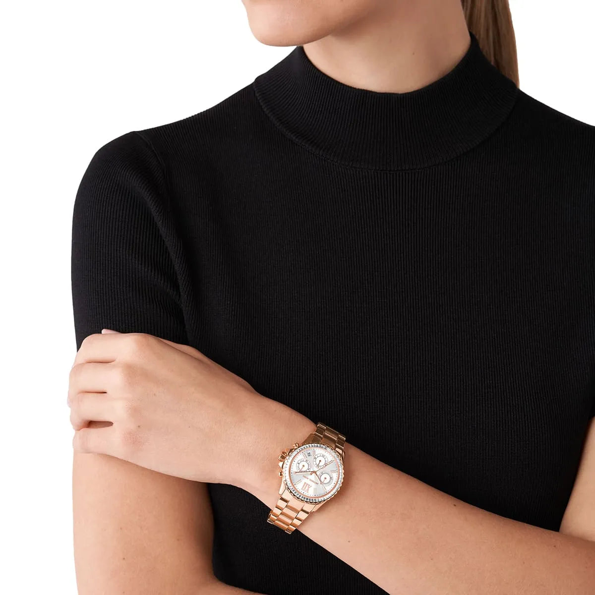 Michael Kors Everest chronograph watch worn on wrist, rose gold-tone with white dial visible