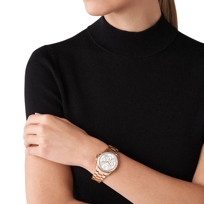 Michael Kors Everest chronograph watch worn on wrist, rose gold-tone with white dial visible