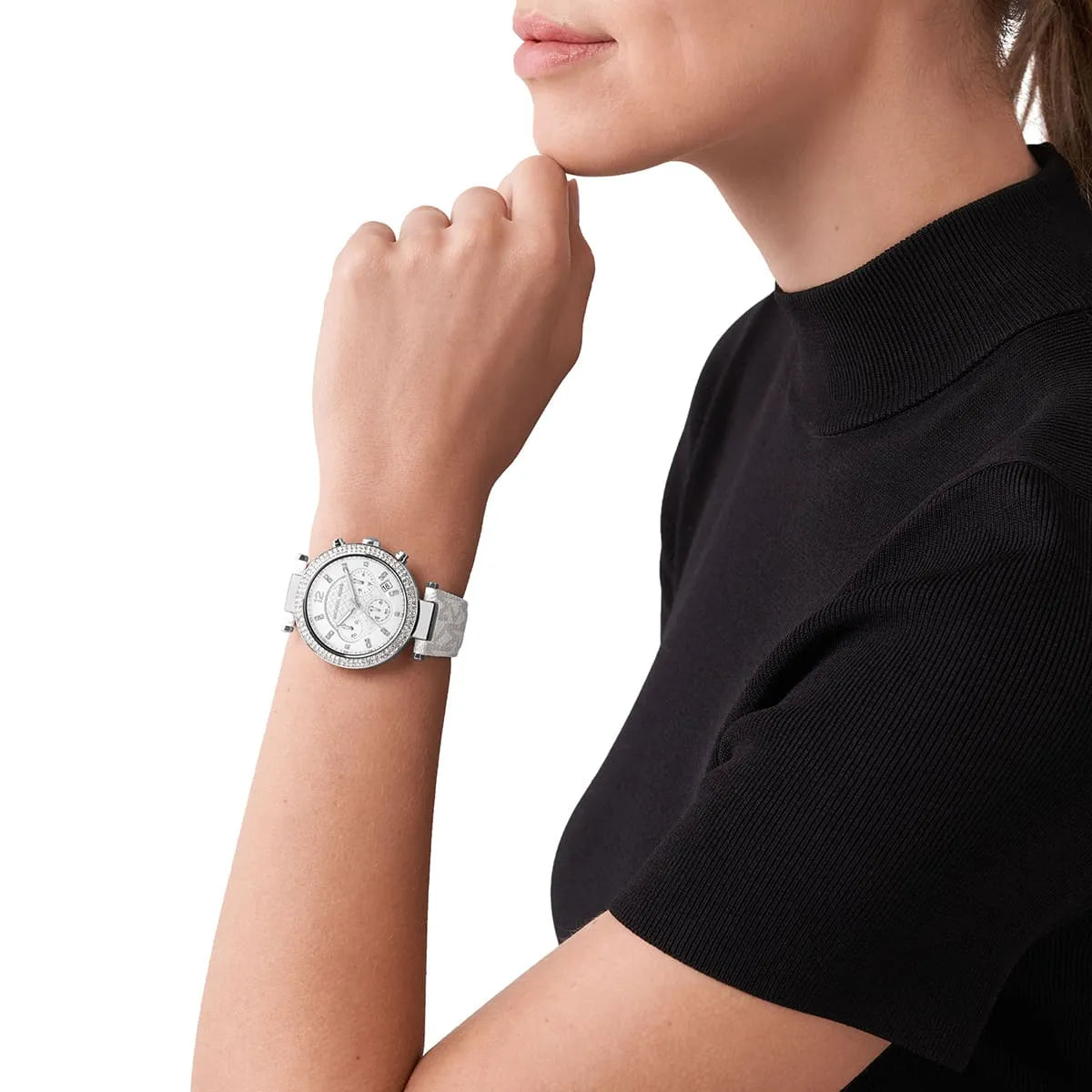 Michael Kors Parker chronograph watch worn on wrist showing white dial and strap