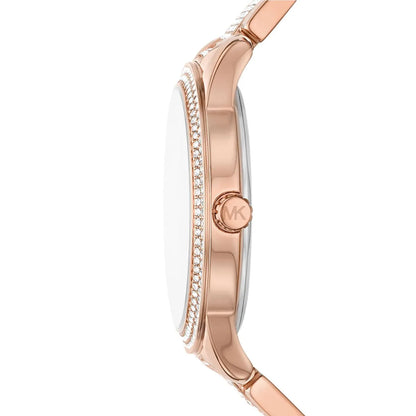 Michael Kors Tibby women's watch shown in profile with rose gold stainless steel case and crystal-set band