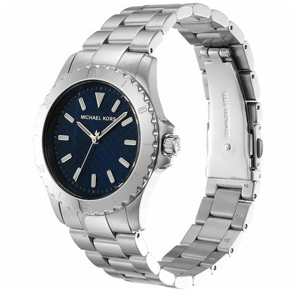 Michael Kors Everest MK9079 angled view showing blue dial, rotating bezel and metal bracelet