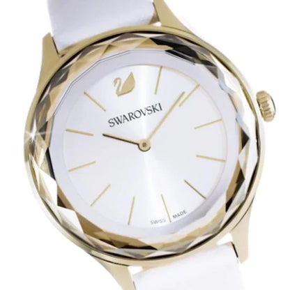 Close-up of Swarovski Octea Nova dial featuring Swarovski logo and white face with gold markers
