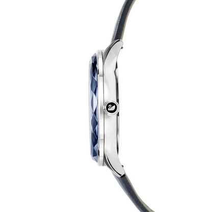 Side profile of Swarovski Octea Nova watch showing faceted blue crystal bezel and case
