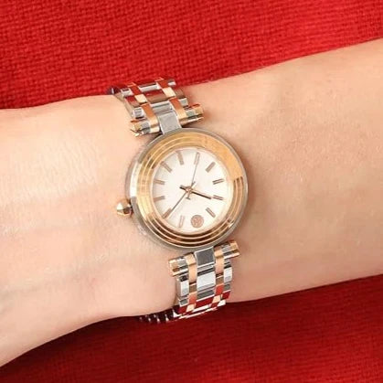 Tory Burch TBW9013 watch worn on wrist with two-tone gold and silver bracelet