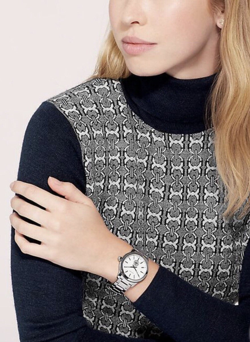 Tory Burch Collins watch worn on wrist with patterned knit top styling
