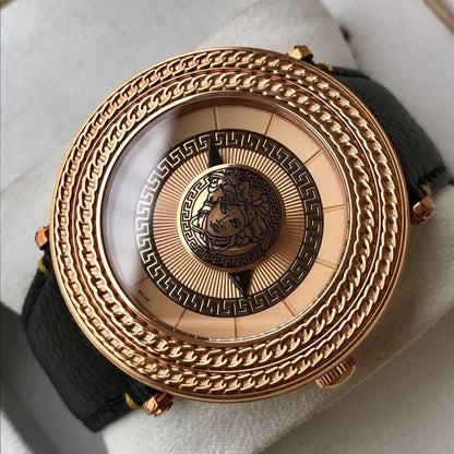 Close-up of Versace V-Metal Icon watch dial featuring Medusa head and greek key pattern