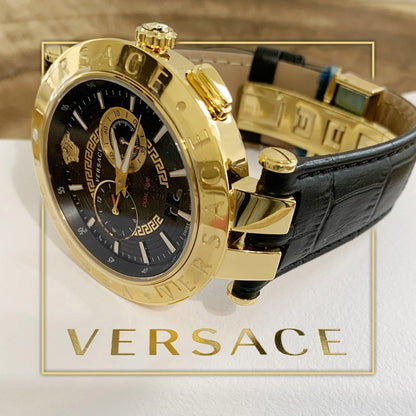 Versace V-Race men's watch worn on wrist with black leather strap and gold-tone chronograph case